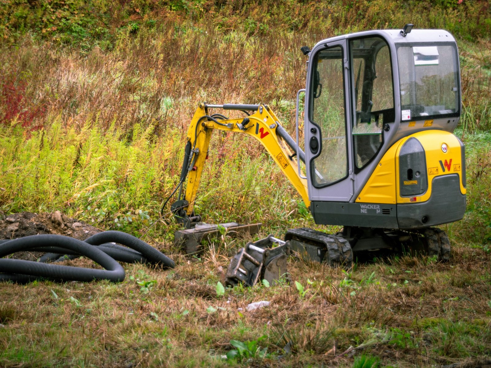 T Seven team leveling and preparing ground for building foundations